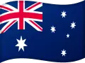 Bilden visar Australiens flagga, som är mörkblå med Union Jack i det övre vänstra hörnet. Den har en stor sjuspetsig stjärna i nedre vänstra hörnet och Södra korset, en konstellation av fem stjärnor, i den högra halvan.